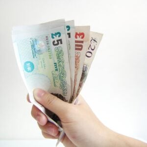uk money fanned out in a hand